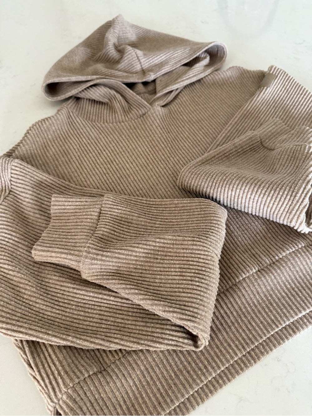 ALO Muse Ribbed Hooded Top in Taupe Beige; hoodie/sweatshirt